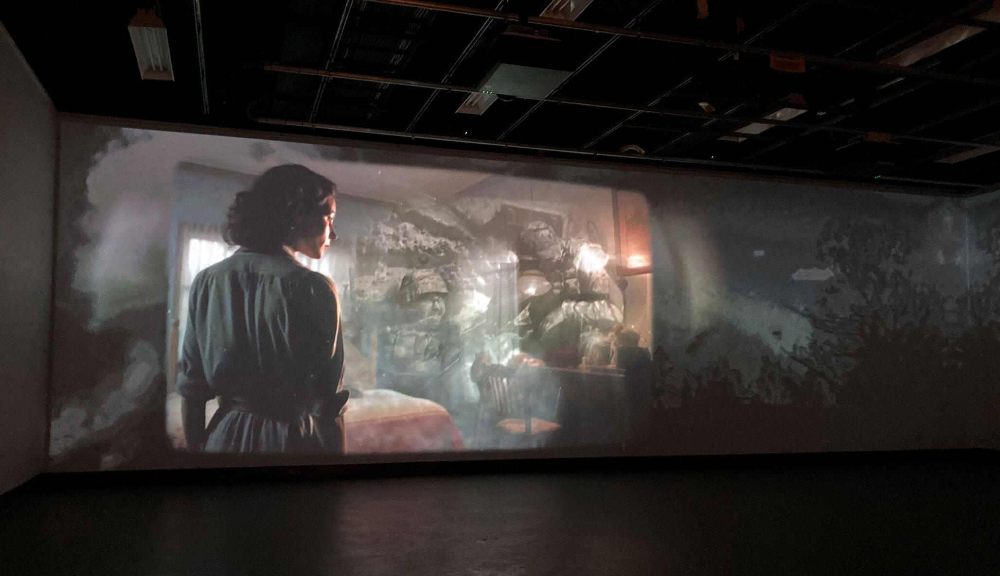 Testing the videos as shown through a projector. The picture shows Participants 34's vision large scale on a gallery wall.